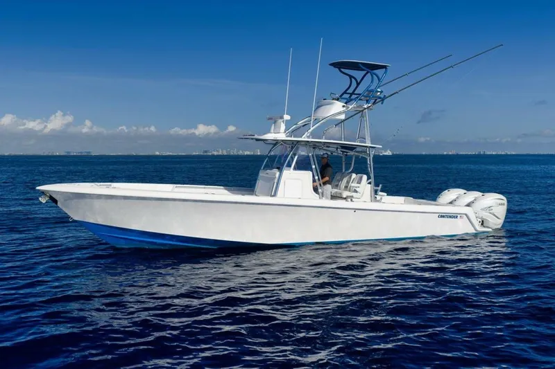 Top Shelf Too Yacht Photos Pics 2023 Contender 39 ST boat on open ocean under clear blue sky.