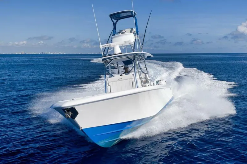 Top Shelf Too Yacht Photos Pics 2023 Contender 39 ST boat cruising on open ocean waters.