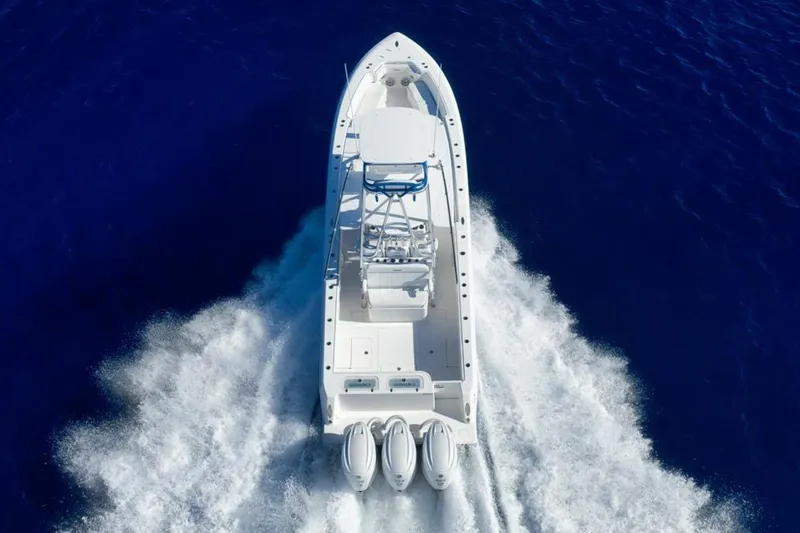 Top Shelf Too Yacht Photos Pics 2023 Contender 39 ST boat cruising on deep blue ocean waters.