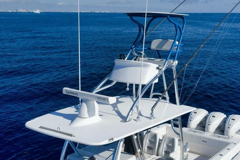 Top Shelf Too Yacht Photos Pics 2023 Contender 39 ST boat with tower and Garmin radar on open ocean.