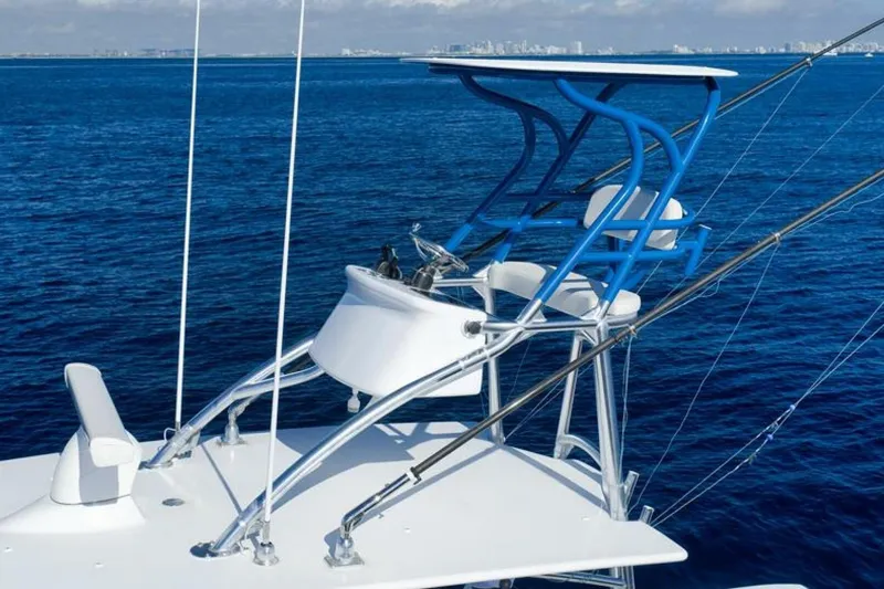 Top Shelf Too Yacht Photos Pics 2023 Contender 39 ST boat with blue tower on open ocean.