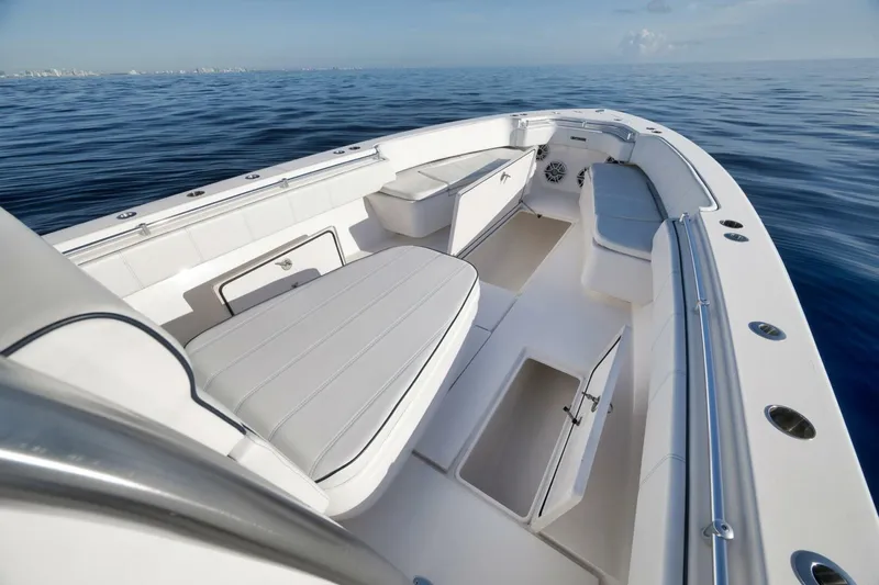 Top Shelf Too Yacht Photos Pics 2023 Contender 39 ST boat interior with seating and storage, on calm ocean waters.