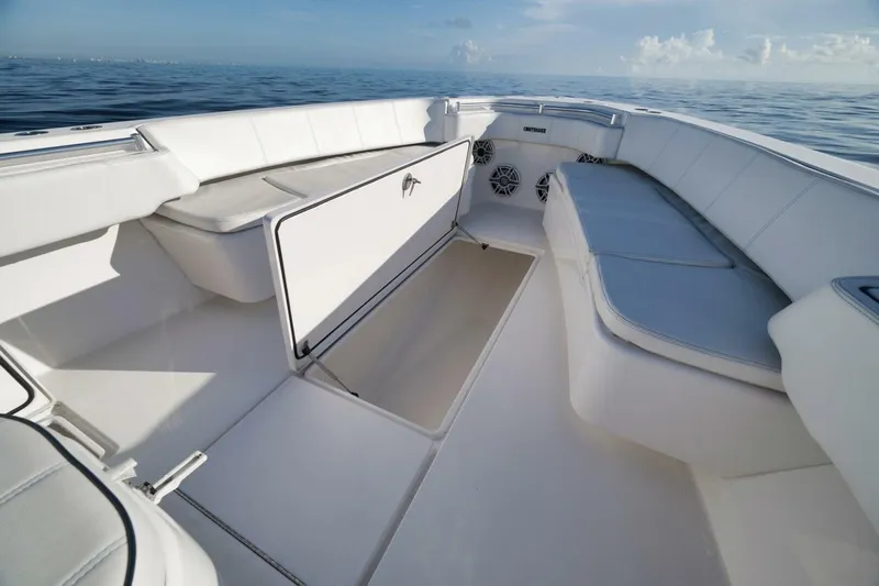 Top Shelf Too Yacht Photos Pics 2023 Contender 39 ST boat interior with white seating and storage compartments.