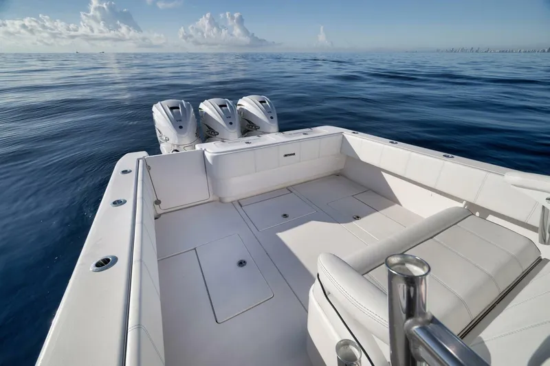 Top Shelf Too Yacht Photos Pics 2023 Contender 39 ST boat with triple engines on calm ocean.