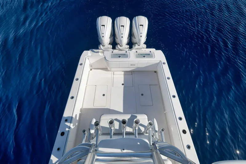 Top Shelf Too Yacht Photos Pics 2023 Contender 39 ST boat with triple engines on clear blue water.