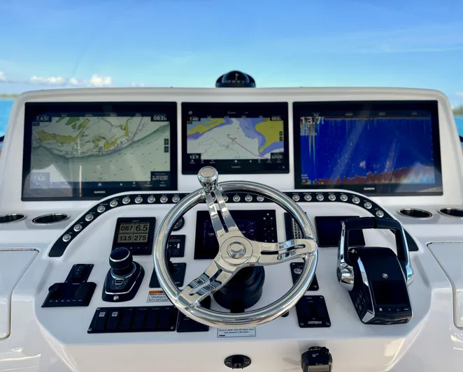  Yacht Photos Pics 2023 Intrepid 427 Nomad SE dashboard with advanced navigation displays and controls.