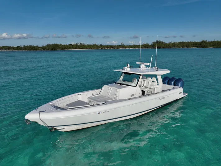  Yacht Photos Pics 2023 Intrepid 427 Nomad SE boat on clear turquoise water.