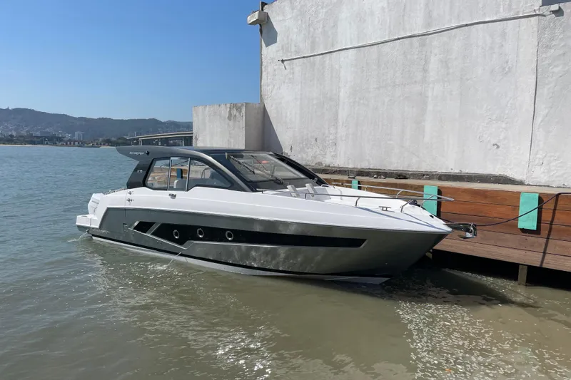  Yacht Photos Pics Schaefer 380 yacht docked by a waterfront, 2026 model, sleek design.