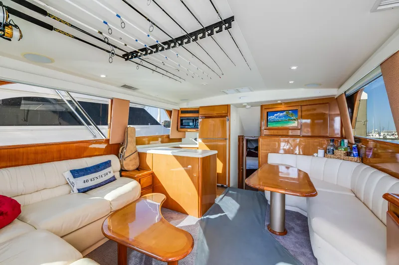  Yacht Photos Pics Luxurious interior of a 1999 Viking 47 Convertible yacht with elegant seating and modern amenities.