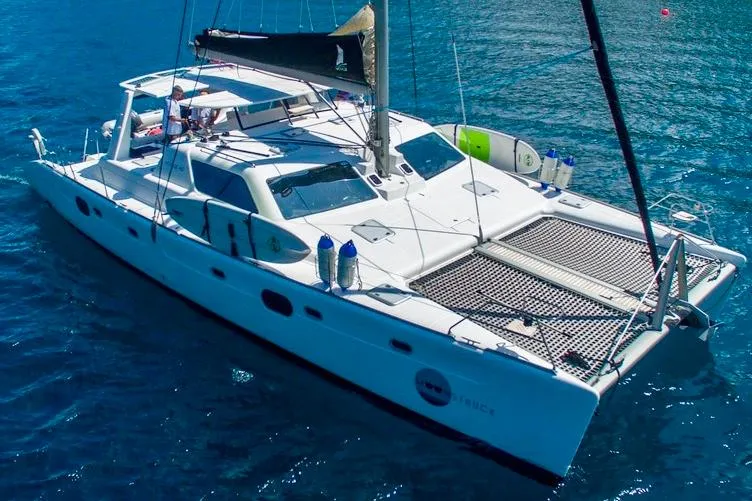 Moonstruck Yacht Photos Pics 2018 Voyage Yachts VOYAGE 480 catamaran sailing on clear blue water.