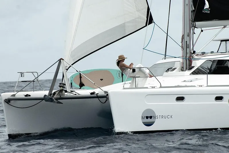 Moonstruck Yacht Photos Pics 2018 Voyage Yachts VOYAGE 480 sailing with a relaxed passenger on deck.