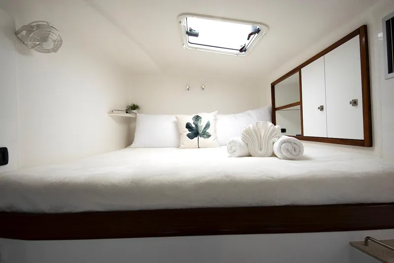 Moonstruck Yacht Photos Pics Luxurious cabin interior of 2018 Voyage Yachts VOYAGE 480 with elegant bedding and decor.