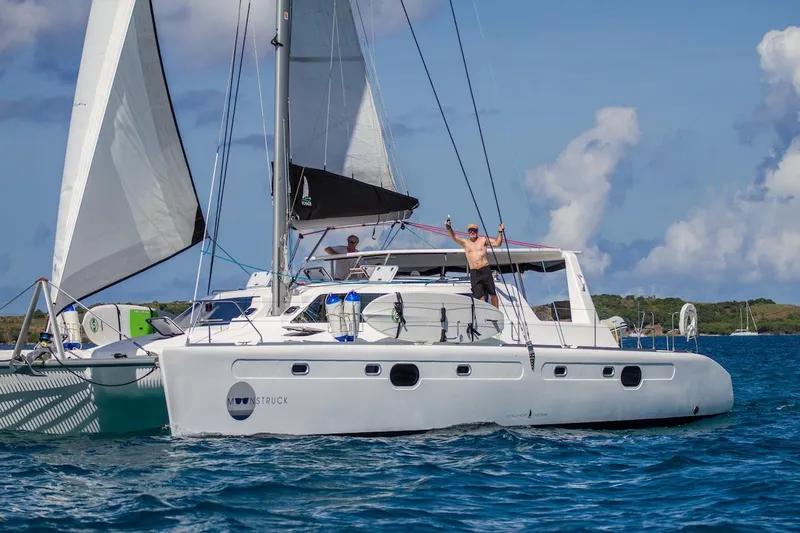 Moonstruck Yacht Photos Pics 2018 Voyage Yachts VOYAGE 480 sailing catamaran on open water, clear skies.