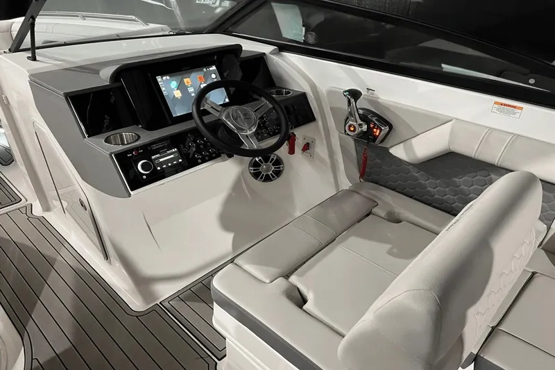  Yacht Photos Pics 2024 Sea Ray SDX 290 helm with modern controls, touchscreen display, and comfortable seating.