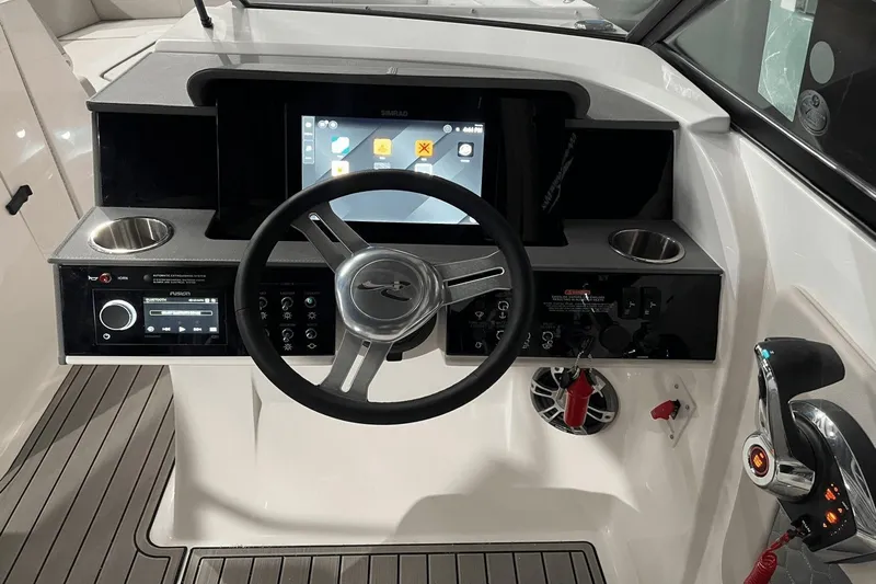 Yacht Photos Pics 2024 Sea Ray SDX 290 helm with steering wheel, touchscreen, and control panel.