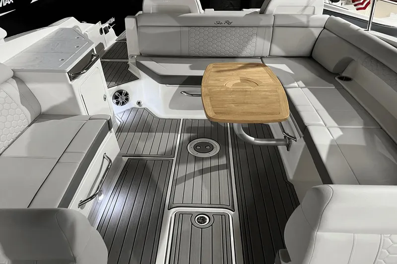  Yacht Photos Pics 2024 Sea Ray SDX 290 boat interior with elegant seating and wooden table.