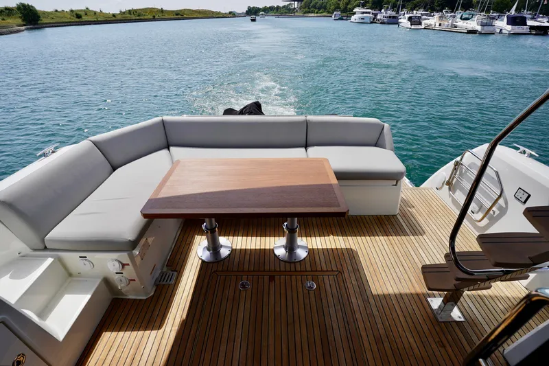  Yacht Photos Pics Luxury seating area on 2023 Prestige 460 yacht with scenic water view.