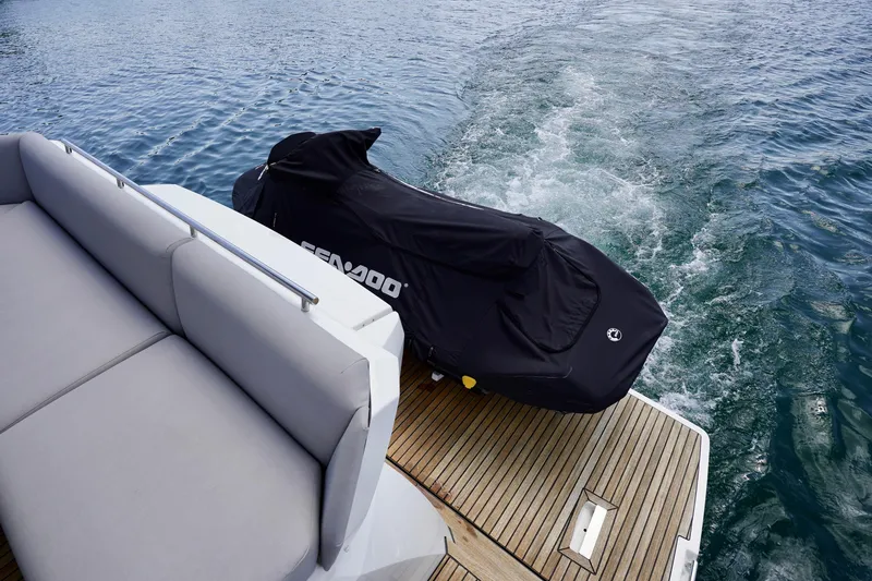  Yacht Photos Pics Luxury yacht Prestige 460 with covered Sea-Doo on deck, cruising on water, 2023 model.