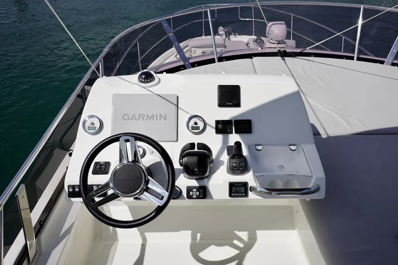  Yacht Photos Pics Cockpit of 2023 Prestige 460 yacht with Garmin navigation system and steering wheel.