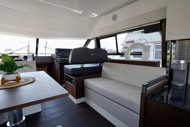  Yacht Photos Pics Luxurious interior of 2023 Prestige 460 yacht with modern seating and decor.