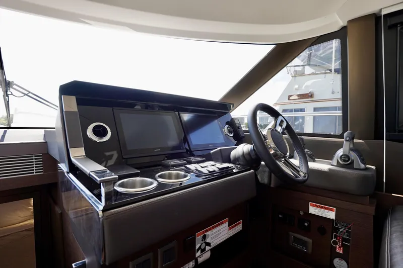  Yacht Photos Pics 2023 Prestige 460 yacht helm with modern controls and navigation screens.