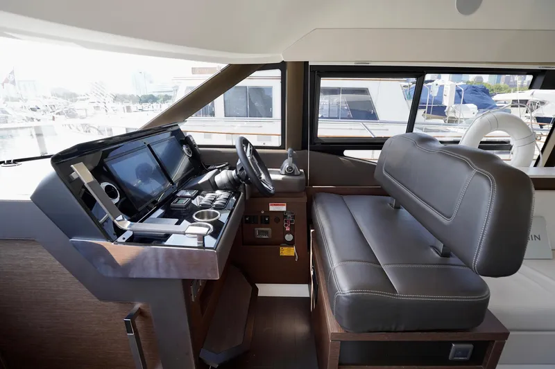  Yacht Photos Pics 2023 Prestige 460 yacht helm with modern controls and leather seating.