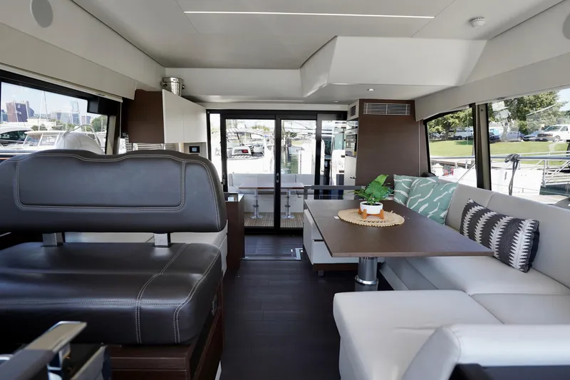  Yacht Photos Pics Luxurious interior of 2023 Prestige 460 yacht with modern seating and elegant decor.