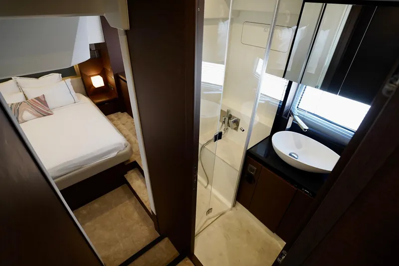  Yacht Photos Pics Luxurious interior of 2023 Prestige 460 yacht featuring bedroom and modern bathroom.