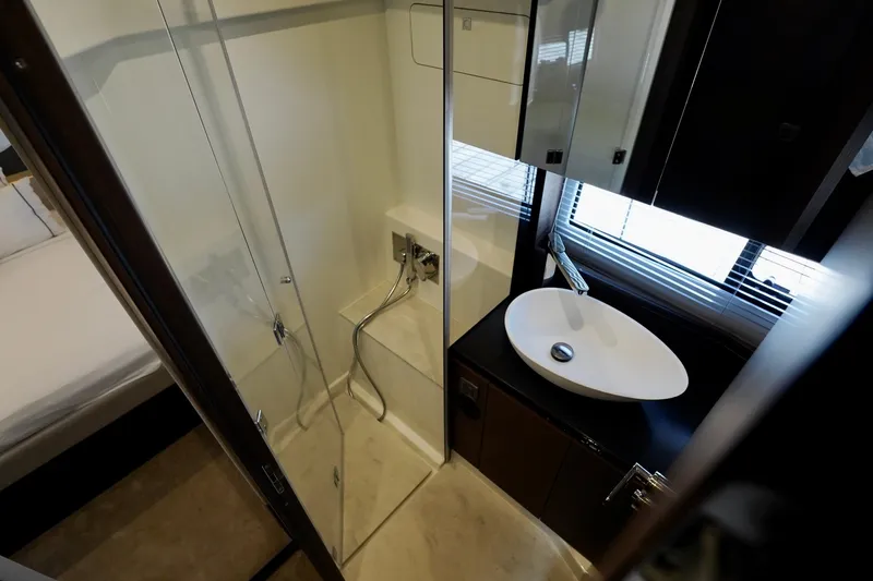  Yacht Photos Pics Modern bathroom interior in 2023 Prestige 460 yacht, featuring sleek shower and stylish sink.