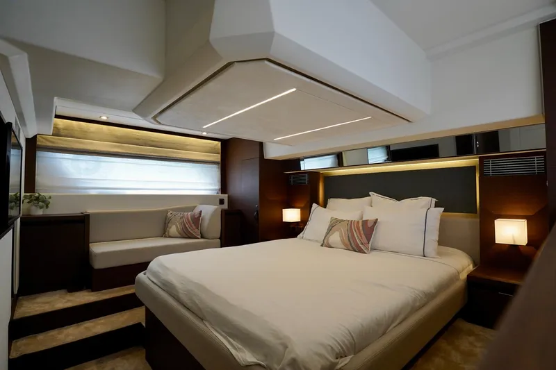  Yacht Photos Pics Luxurious bedroom interior of 2023 Prestige 460 yacht, featuring elegant lighting and modern design.