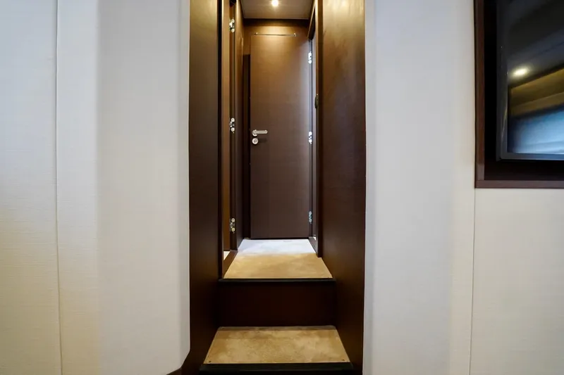  Yacht Photos Pics Interior of 2023 Prestige 460 yacht, featuring elegant wooden stairs and modern design.