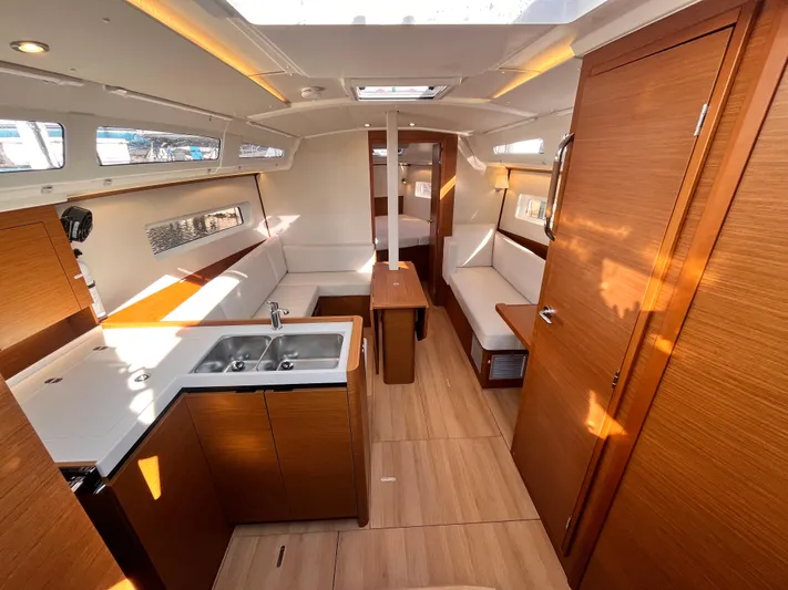  Yacht Photos Pics Interior of 2024 Jeanneau 380 yacht, featuring modern wood finishes and spacious layout.