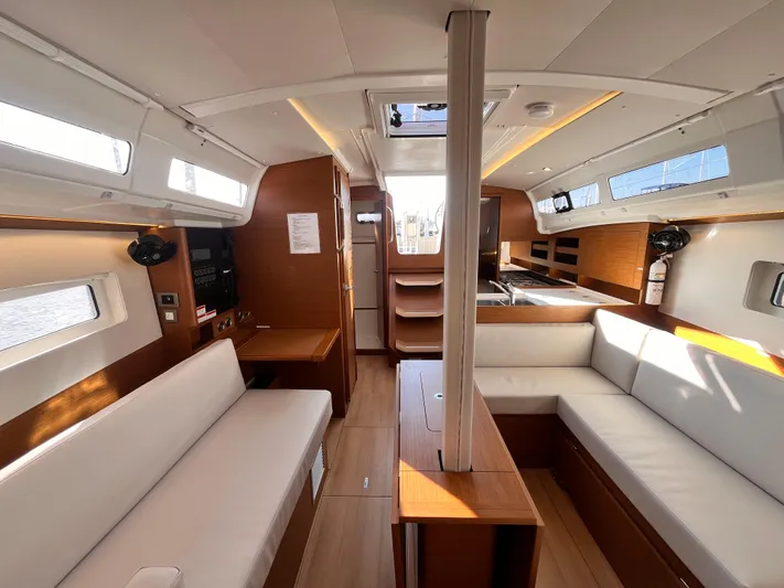 Yacht Photos Pics Interior of 2024 Jeanneau 380 yacht, featuring modern design and spacious seating area.