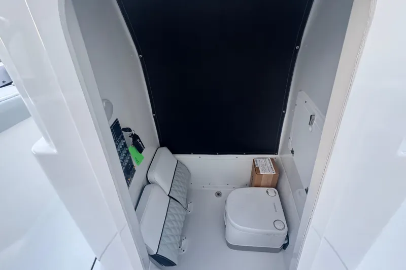 Your Next Boat! Yacht Photos Pics Interior of 2026 Blackfin 242 HB boat featuring compact marine toilet.
