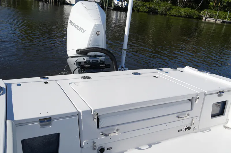Your Next Boat! Yacht Photos Pics 2026 Blackfin 242 HB boat with Mercury outboard engine on calm water.