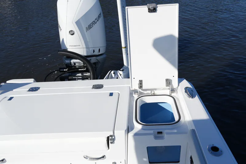 Your Next Boat! Yacht Photos Pics 2026 Blackfin 242 HB boat with Mercury Verado engine, open storage compartment.