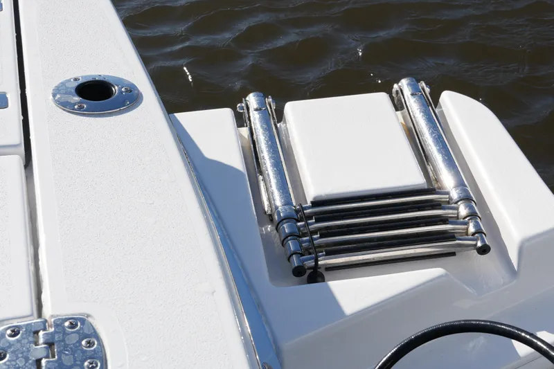 Your Next Boat! Yacht Photos Pics 2026 Blackfin 242 HB boat with stainless steel swim ladder on deck.