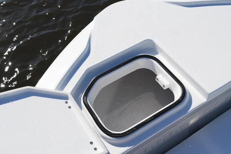 Your Next Boat! Yacht Photos Pics Open storage compartment on 2026 Blackfin 242 HB boat, near water surface.