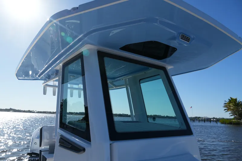 Your Next Boat! Yacht Photos Pics 2026 Blackfin 242 HB boat on water, sunny day, sleek design, modern features.