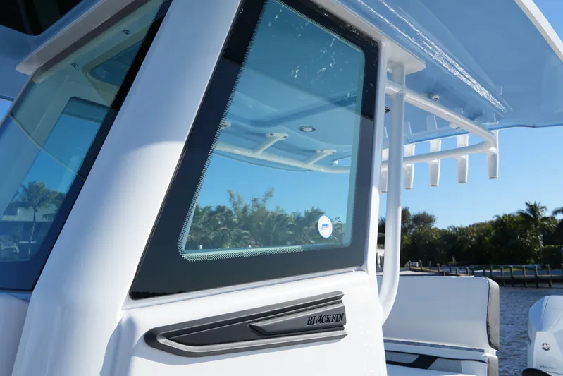 Your Next Boat! Yacht Photos Pics 2026 Blackfin 242 HB boat, close-up of window and sleek design features.