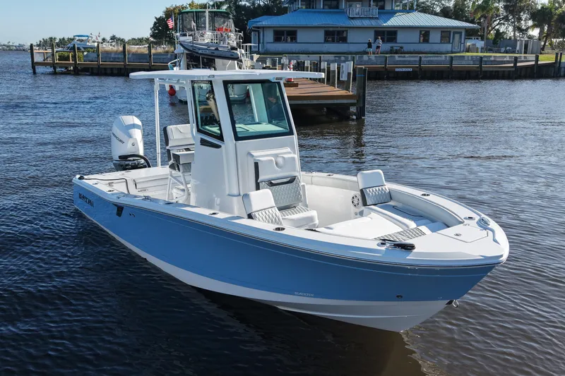 Your Next Boat! Yacht Photos Pics 2026 Blackfin 242 HB boat docked on calm water, showcasing sleek design and modern features.
