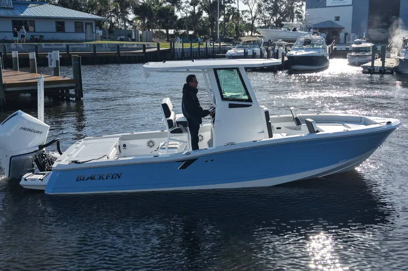 Your Next Boat! Yacht Photos Pics 2026 Blackfin 242 HB boat on water, featuring sleek design and Mercury engine.