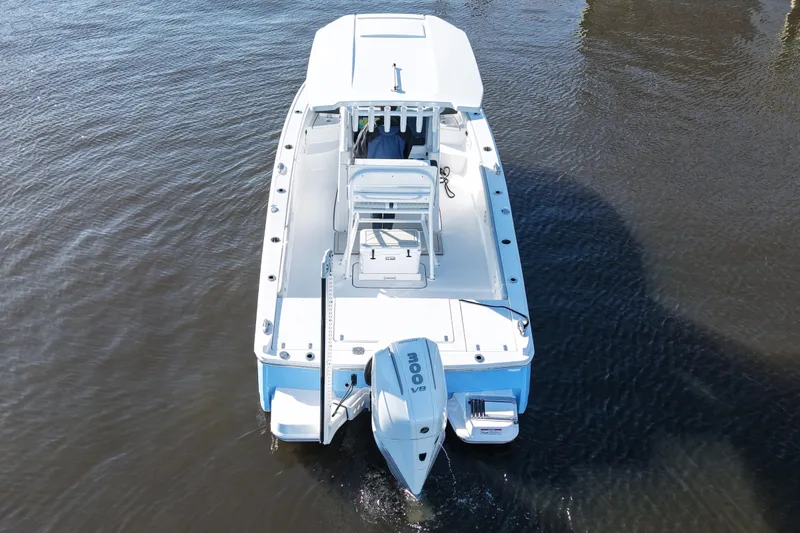 Your Next Boat! Yacht Photos Pics 2026 Blackfin 242 HB boat on water, aerial view, showcasing sleek design and powerful engine.