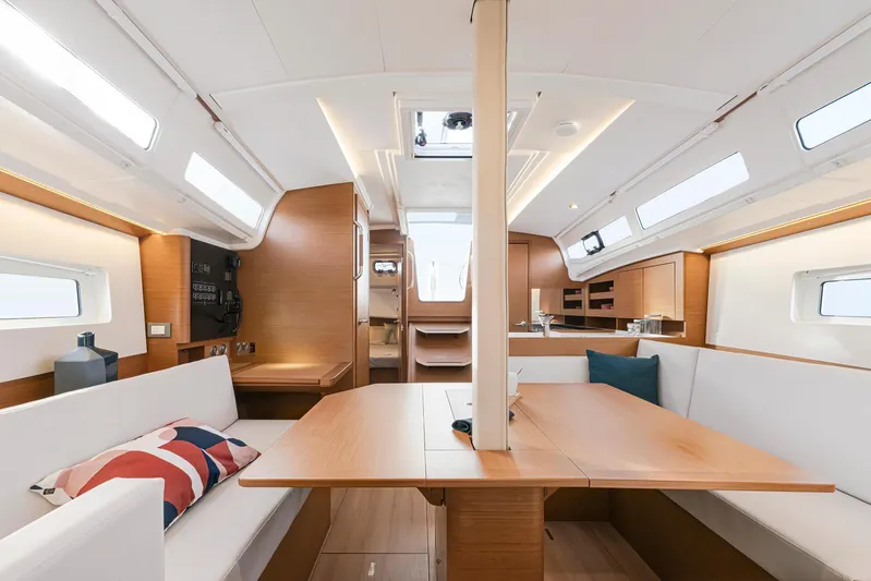  Yacht Photos Pics Interior of 2024 Jeanneau 380 sailboat, featuring modern design and spacious seating area.