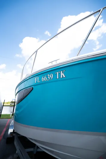  Yacht Photos Pics 2023 Regal 26 XO boat with blue hull and registration number FL 6639 TK.