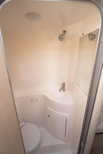  Yacht Photos Pics 2023 Regal 26 XO boat bathroom with compact design and modern fixtures.