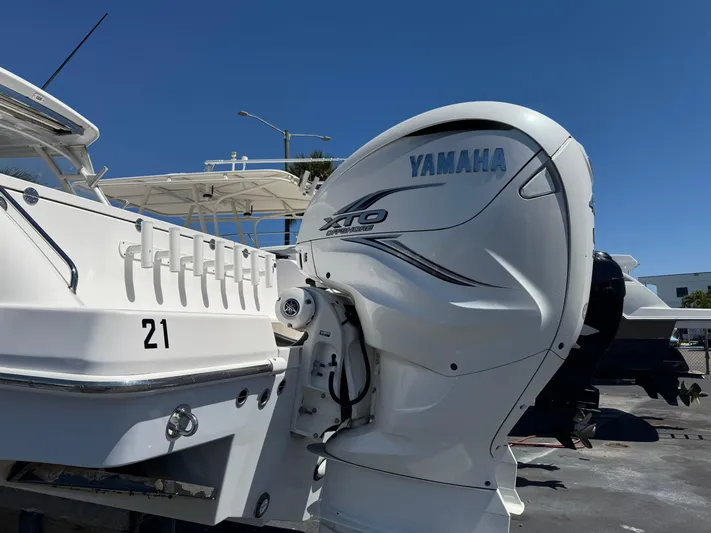  Yacht Photos Pics 2019 Everglades 340 Dual Console with Yamaha XTO outboard engine, docked under clear blue sky.