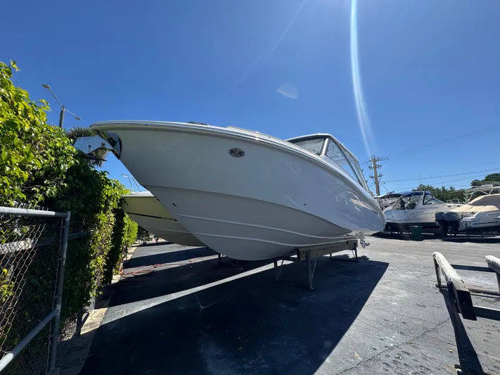  Yacht Photos Pics 2019 Everglades 340 Dual Console boat on display under clear blue sky.