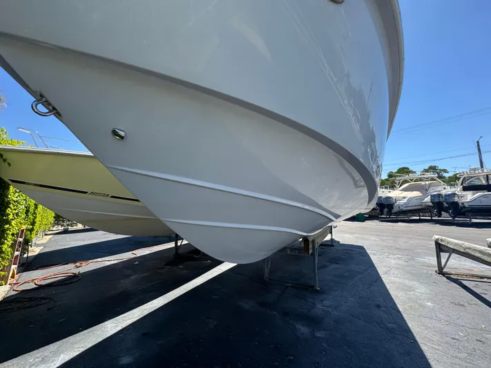  Yacht Photos Pics 2019 Everglades 340 Dual Console boat hull on display in a sunny outdoor setting.
