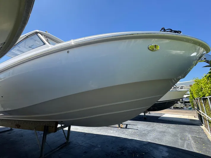  Yacht Photos Pics 2019 Everglades 340 Dual Console boat on display under clear blue sky.
